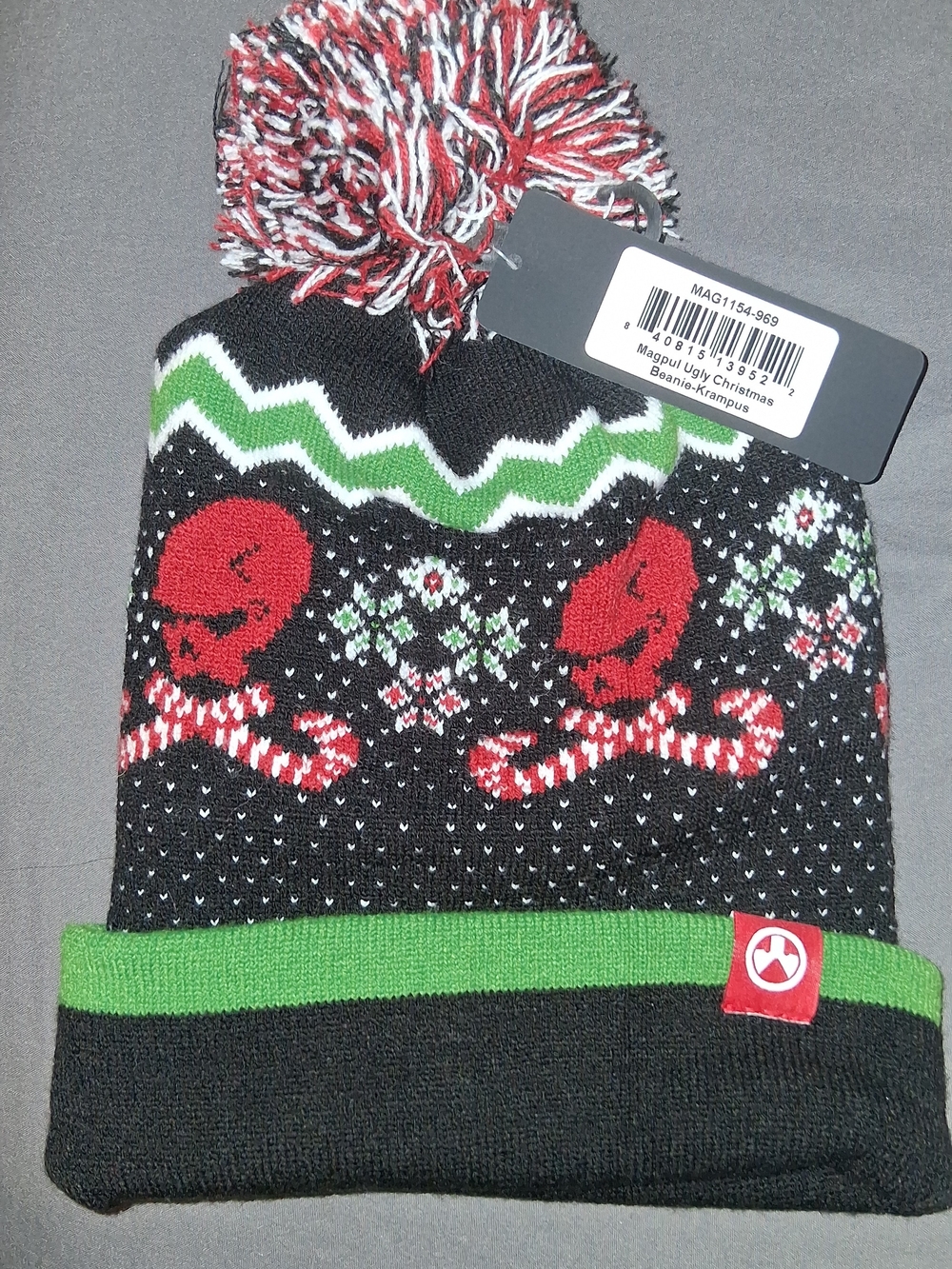 Black Knit Pom Beanie with Red & Green Holiday Skulls